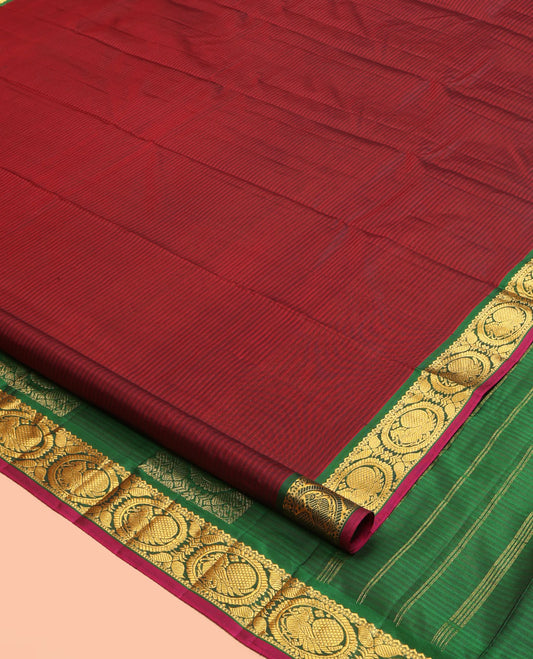 Maroon Kanchipuram Silk Saree, Elevated with Vazhaipoo Stipes and Zari Buttas, a Contrast Traditional Mayil Motif Border, Pallu of Zari Design, and Contrast Blouse