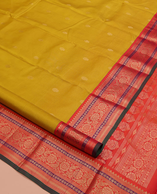 Yellow Vasundhara Silk Saree, Featuring Zari Buttas All Over Its Body, Complemented by a Contrast Border of Thilakam, Manga, Kamalam, Kathir, and Kodi Visiry Designs, Grand Jaal Pallu, and Paired with a Contrast Blouse