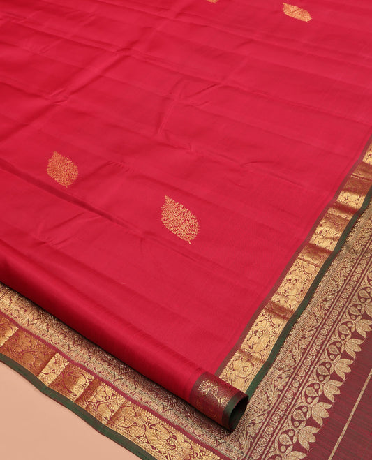 Red Kanchipuram Silk Saree, Woven with Zari Buttas All Over Its Body, Complemented by a Contrast Border of Mayil Designs, Intricately Designed Pallu, and Paired with a Contrast Blouse