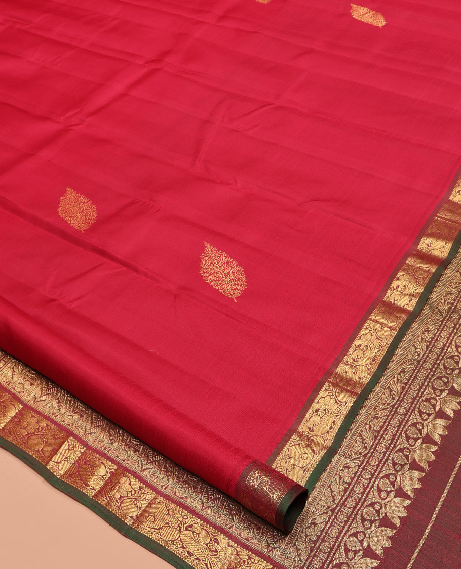 Red Kanchipuram Silk Saree, Woven with Zari Buttas All Over Its Body, Complemented by a Contrast Border of Mayil Designs, Intricately Designed Pallu, and Paired with a Contrast Blouse