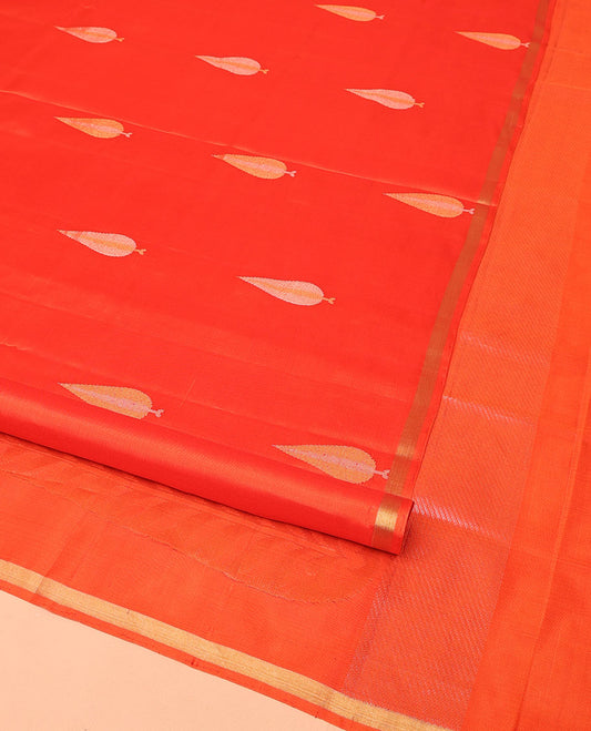 Orange Mayuri Soft Silk Saree, Adorned with Pine-Tree Buttas All Over Its Body, Subtle Zari Piping Border, Sparsely Woven Pallu, and Paired with a Matching Blouse