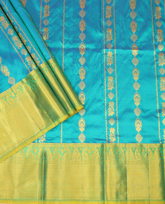 Blue Pure Silk Half-Saree Gracefully Highlighted with Zari Designs on Its Skirt, Complemented by a Contrast Border Featuring Neli, Manga, Rekku, Rudraksham, and Mayil Kann, Comes with a Contrast Blouse and a Dhavani of Butta Enclosed Jaal Designs