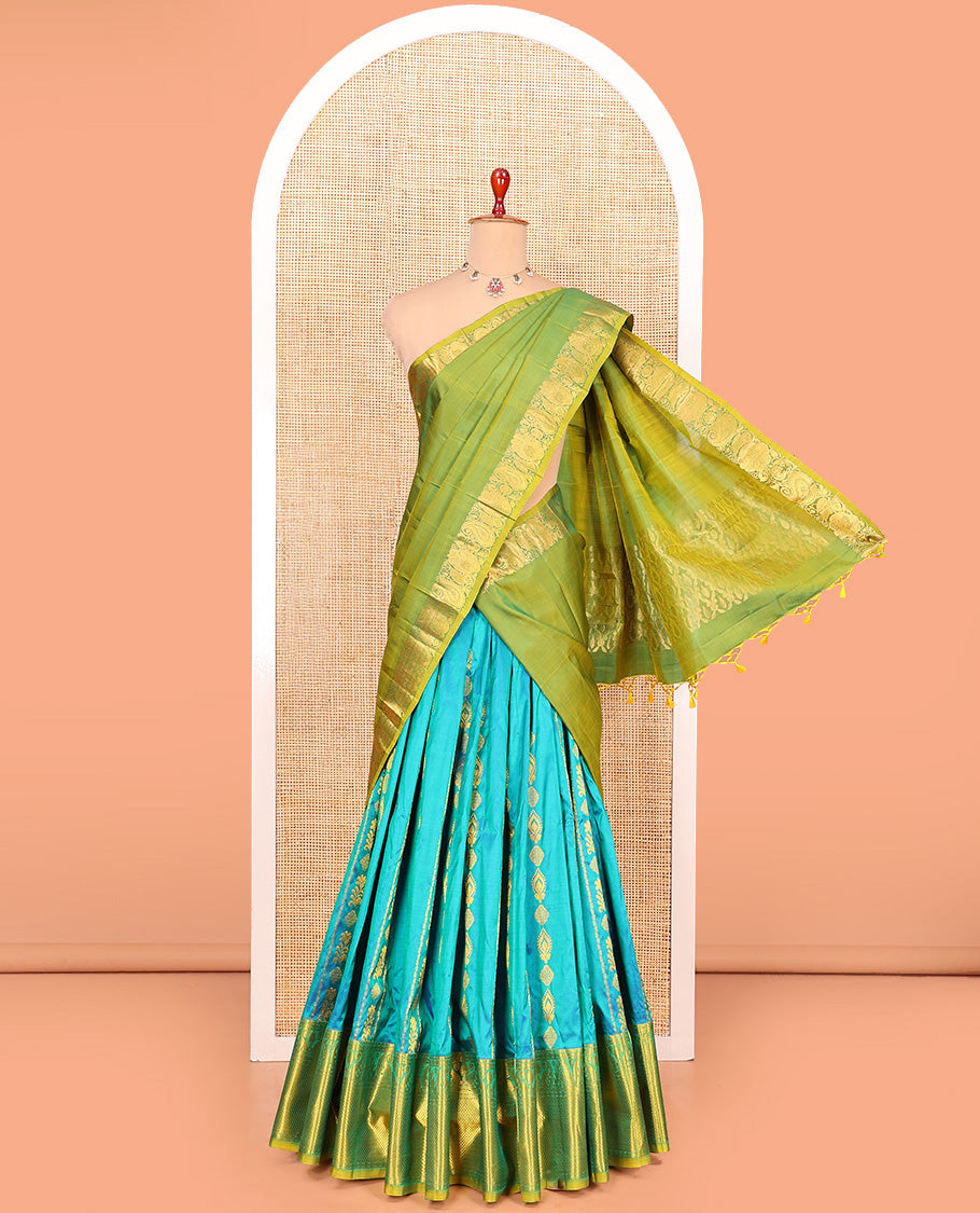 Blue Pure Silk Half-Saree Gracefully Highlighted with Zari Designs on Its Skirt, Complemented by a Contrast Border Featuring Neli, Manga, Rekku, Rudraksham, and Mayil Kann, Comes with a Contrast Blouse and a Dhavani of Butta Enclosed Jaal Designs