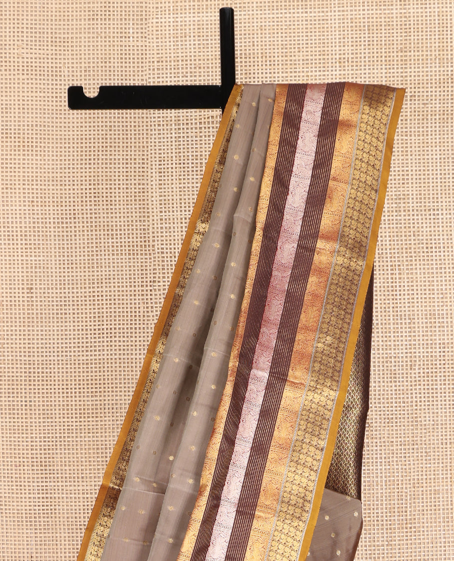 Grey Vasundhara Lite Silk Mix Saree, Elegantly Decked up with Zari Buttas on Its Body, Complemented by a Contrast Border of Muthu, Stripes, Yaali, and Mayil Designs, Intricately Designed Pallu, and Paired with a Contrast Blouse
