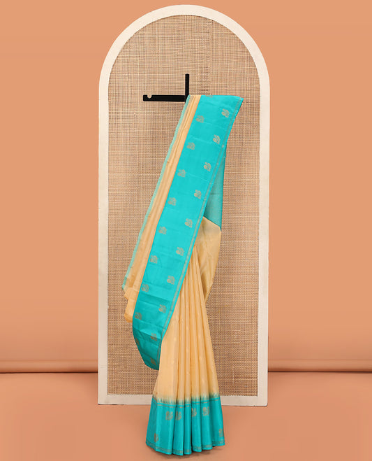 Sandal Vasundhara Lite Silk Mix Saree Enlivened With Zari Buttas, Featuring a Contrast Border of Thazampoo Rekku,  and Mayil Designs, Zari Woven Pallu of Jaal Designs, and a Contrast Blouse