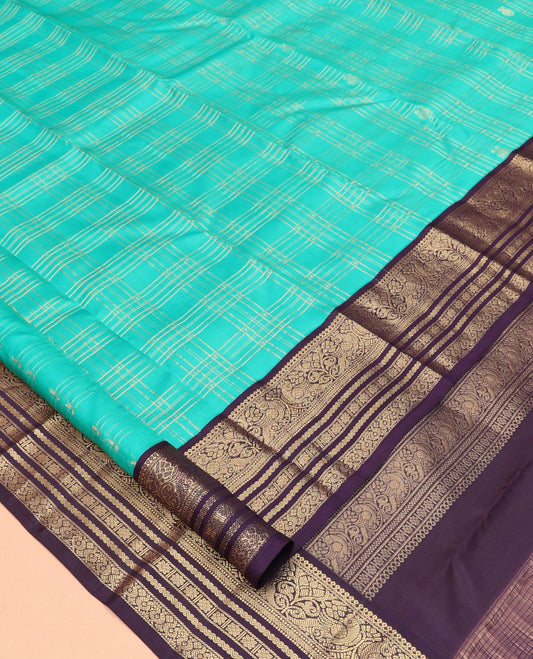 Turquoise Vasundhara Silk Saree, Accentuated with Zari Checks, a Contrast Border of Thilakam Mokku, Mayil, Neli, and Kamalam Designs, a Grand Jaal Pallu, and a Contrast Blouse