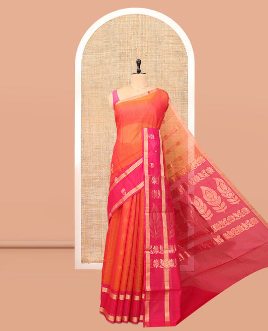 Orange Silk Cotton Saree, Gleamed Up with Zari Buttas, a Contrast Floral Creeper Border, Floral Pallu, and a Contrast Blouse
