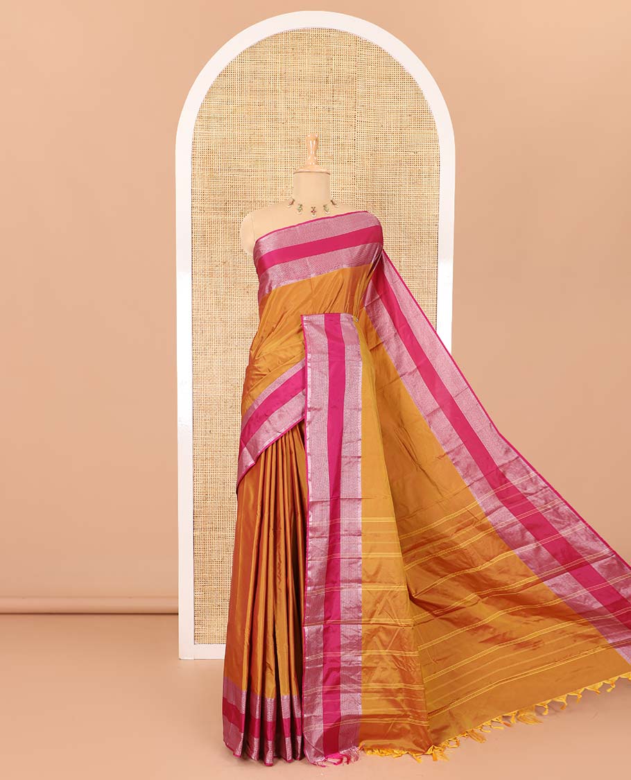 Gold plain semi-soft silk saree with contrast plain border of stripes, striped pallu, and a matching blouse
