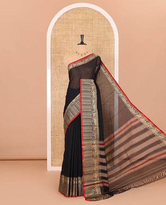 Black plain mercerised cotton saree, contrast traditional motifs thread woven border, striped pallu, and a matching blouse