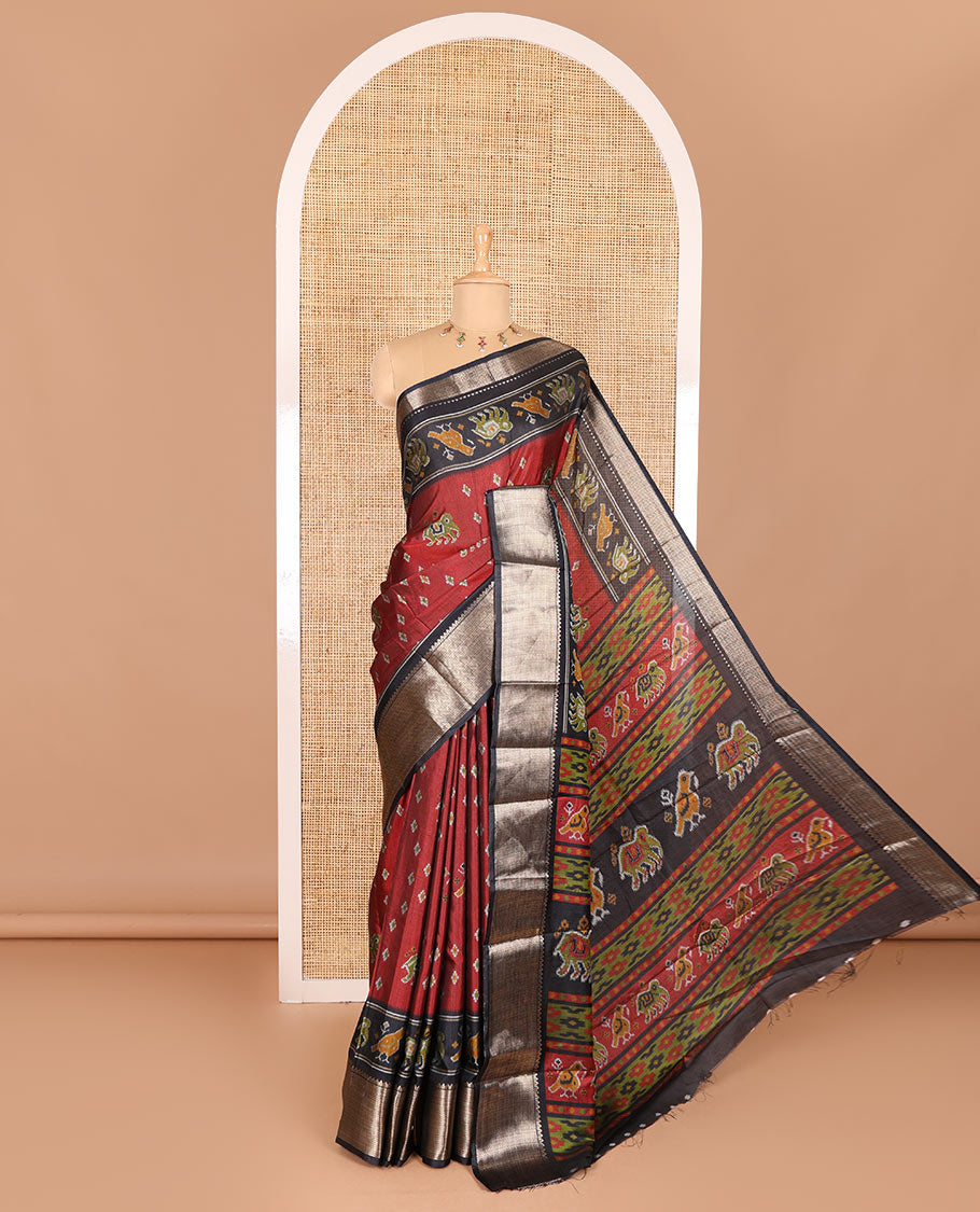 Maroon patola elephant motifs printed Dola silk saree, contrast zari border, and pallu of animal patola motifs print, and a contrast butta printed blouse