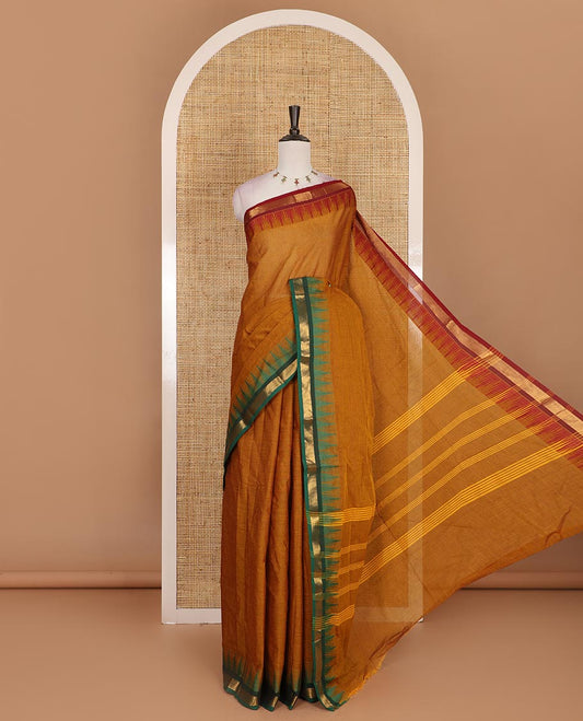 Mustard plain Chettinad cotton saree, contrast ganga jamuna temple zari border, striped pallu, and plain blouse