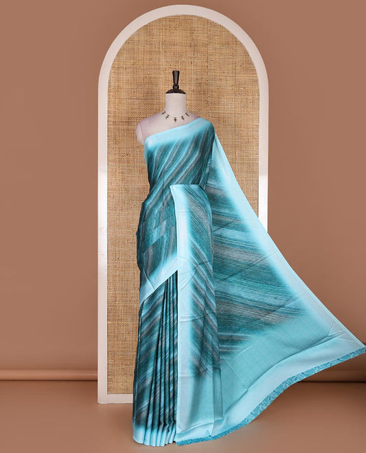 Blue leheriya style hand brush printed satin crepe saree, contrast border, plain pallu, and floral vine printed blouse