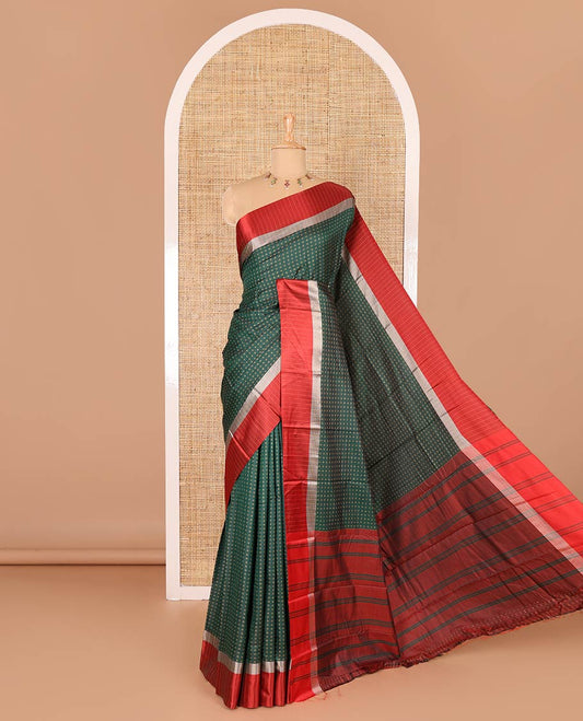 Bottle green thread plus buttas semi-soft silk saree, contrast striped satin border, striped pallu, and contrast plus buttas blouse