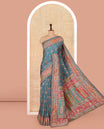 Blue Dola Silk Saree, Opulently Embellished with Colorful Floral-Paisley Design on Its Body, Highlighted by Print and Embroidery Border, Colorfully Decked Up Pallu, and Paired with a Contrast Blouse