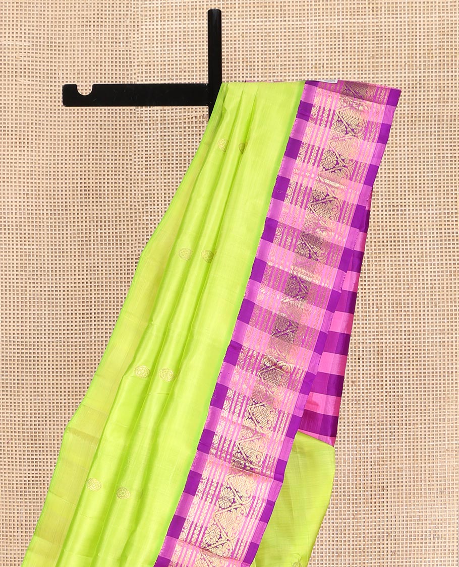 Green Kanchipuram Silk Saree, Embellished with Zari Buttas on Its Body, Complemented by a Contrast One-Sided Korvai Checked Border of Zari Designs, Pallu Features Zari Designs, and Comes Without a Blouse