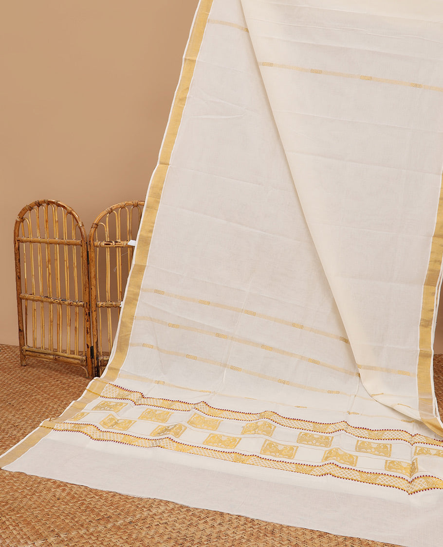 Cream kerala saree with zari designs, zari border & pallu of peacock designs