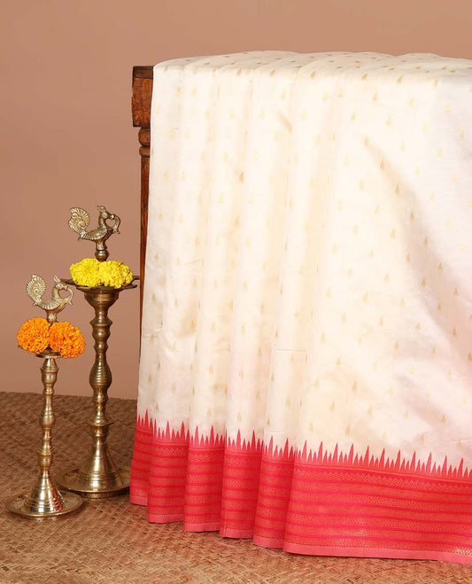 Cream with rani pink temple butta kanchi silk saree with temple, traditional zari border & rich weaving pallu along with butta design blouse