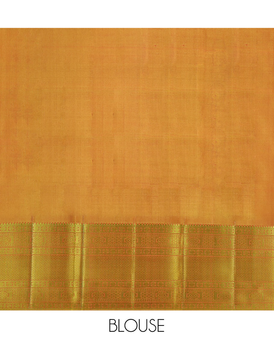 Orange Kanchipuram Silk Saree, Subtly Sparkled with Mayil-Chakram Buttas All Over Its Body, Complemented by a Contrast Border of Rekku, Kamalam, Poun, Chakram, Kuyil Kann, and Then Kuli Kann Designs, Jaal Design Pallu, and Paired with a Contrast Blouse