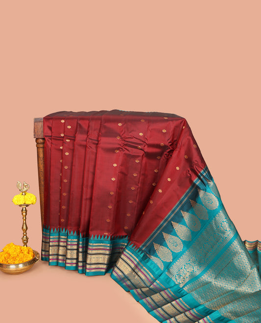 Maroon Gadwal Silk Saree, Beautifully Bedecked with Zari Buttas, Complemented by a Contrast Traditional Zari Design Temple Border, Jaal Pallu, and a Contrast Blouse