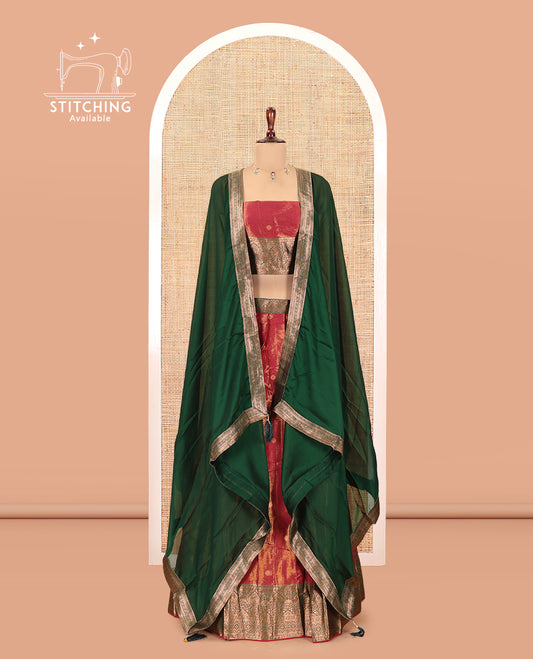 Rust-Green Shimmer Tissue Half-Saree Features Buttas Skirt, a Contrast Traditional Border, a Matching Blouse, a Contrast Dhavani