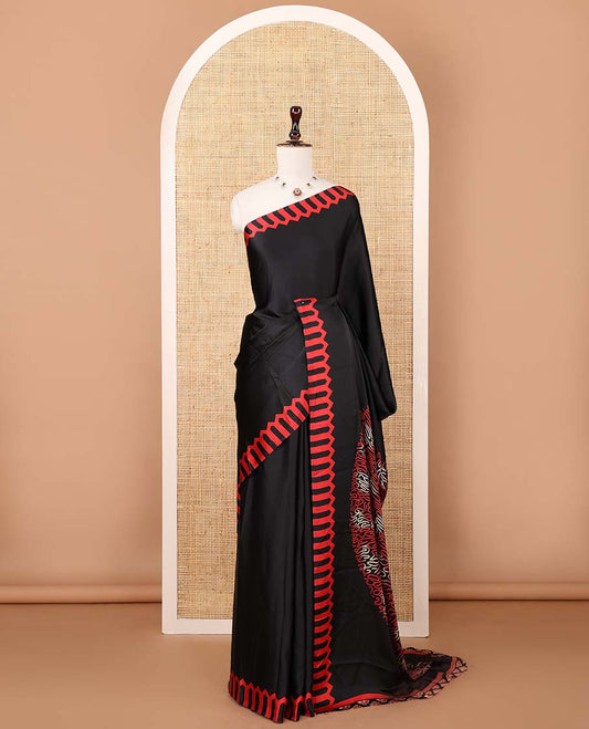 Black plain gajji silk saree features a temple-printed border, a circular-shaped vine-patterned pallu, and a unique motif-printed blouse