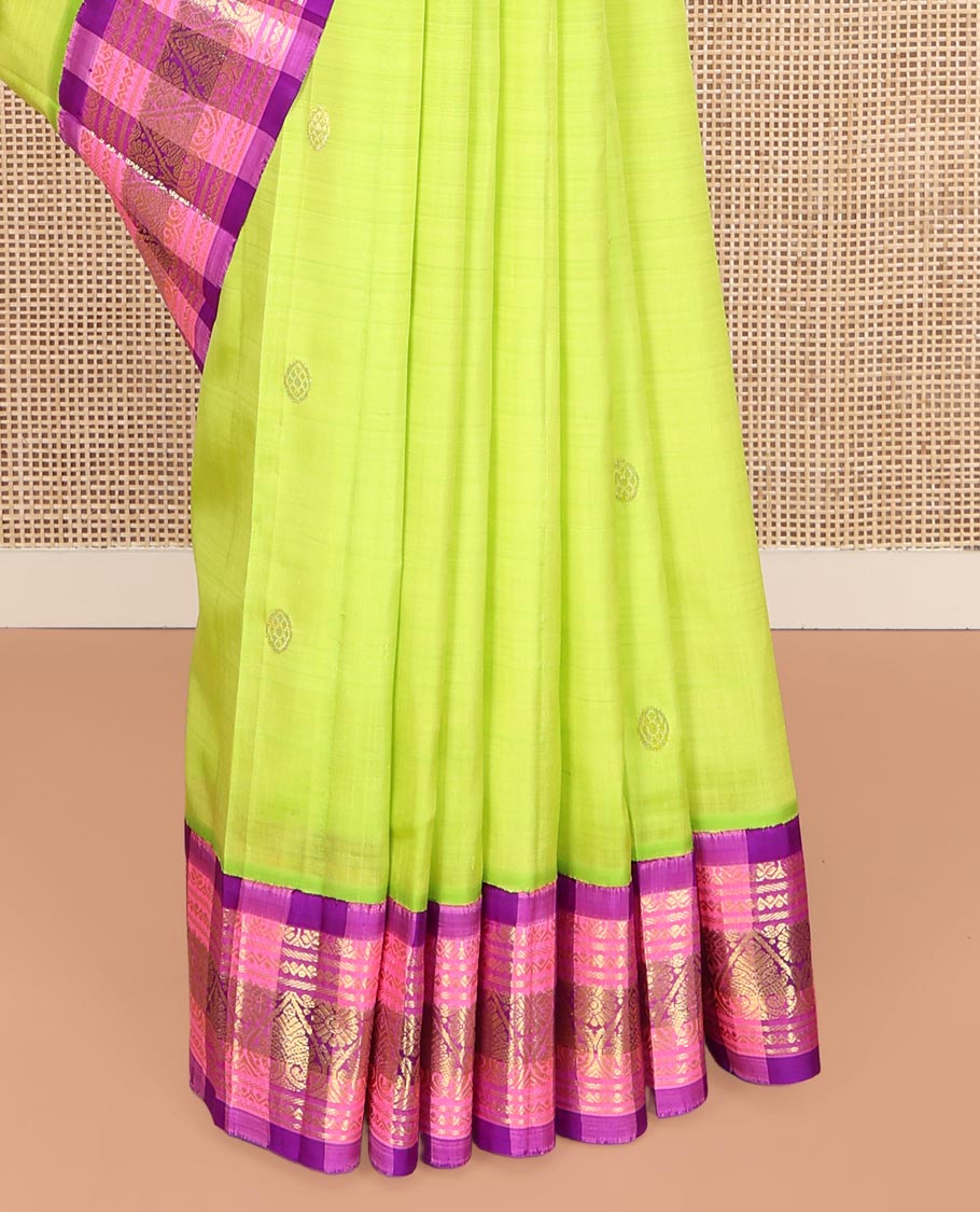 Green Kanchipuram Silk Saree, Embellished with Zari Buttas on Its Body, Complemented by a Contrast One-Sided Korvai Checked Border of Zari Designs, Pallu Features Zari Designs, and Comes Without a Blouse