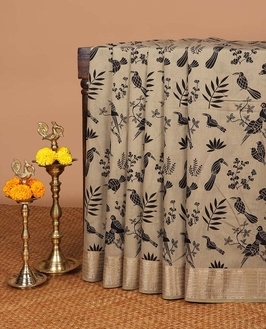 Chikku color birds printed assam silk saree with zari striped border & chit pallu along with butta printed blouse