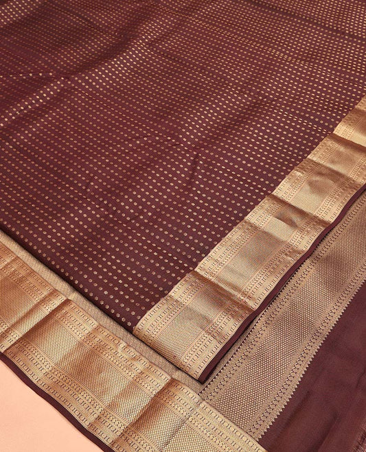 Brown Vasundhara Lite Silk Mix Saree, Masterfully Woven with Zari Buttas All Over Its Body, Highlighted by a Zari Border of Rettai Neli, Poun, Banaras, Manga, and Mayil Kann Designs, Grand Pallu, and Paired with a Matching Blouse