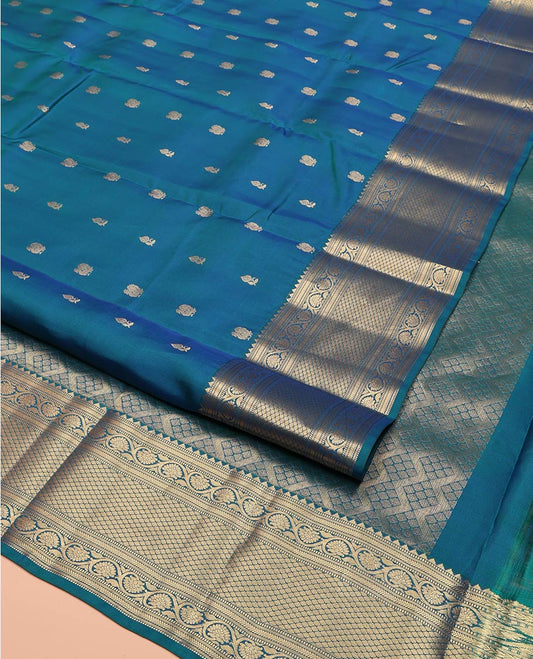Blue Vasundhara Lite Silk Mix Saree, Graced with Zari Buttas All Over Its Body, Highlighted by a Zari Border of Rekku, Muthu, Kathir, Kodi Visiry, and Jaal Designs, Grand Jaal Pallu, and Paired with a Matching Blouse