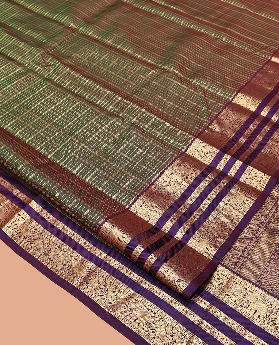 Green Vasundhara Silk Saree, Meticulously Crafted with Zari Butta Enclosed Checks All Over Its Body, Complemented by a Contrast Border of Mayil, Kuthirai, and Yaanai Designs, Grand Jaal Pallu, and Paired with a Contrast Blouse