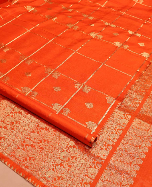 Orange Venkatagiri Silk Saree, Spotlighted with Zari Buttas Enclosed Checks All Over Its Body, Highlighted by Zari Temple Border, Pallu Features Floral and Bird Designs, and Paired with a Matching Blouse