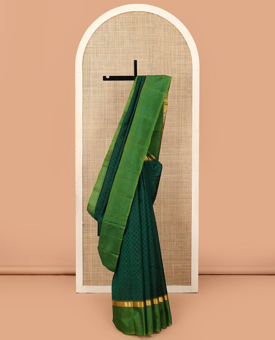 Green payadi kattam Kanchipuram silk saree, contrast kaal erangina border of rekku, and vanki designs, and zari striped pallu