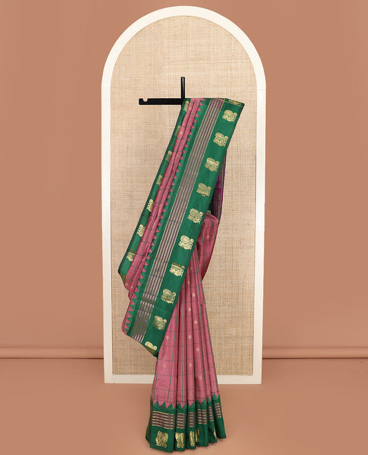 Pink Vasundhara Silk Saree Enthralled with Zari Butta Enclosed Checks, Complemented by a Contrast  Thazampoo Rekku Border of Banaras, and Mayil Designs, Zari Woven Pallu of Jaal Designs, and a Contrast Blouse