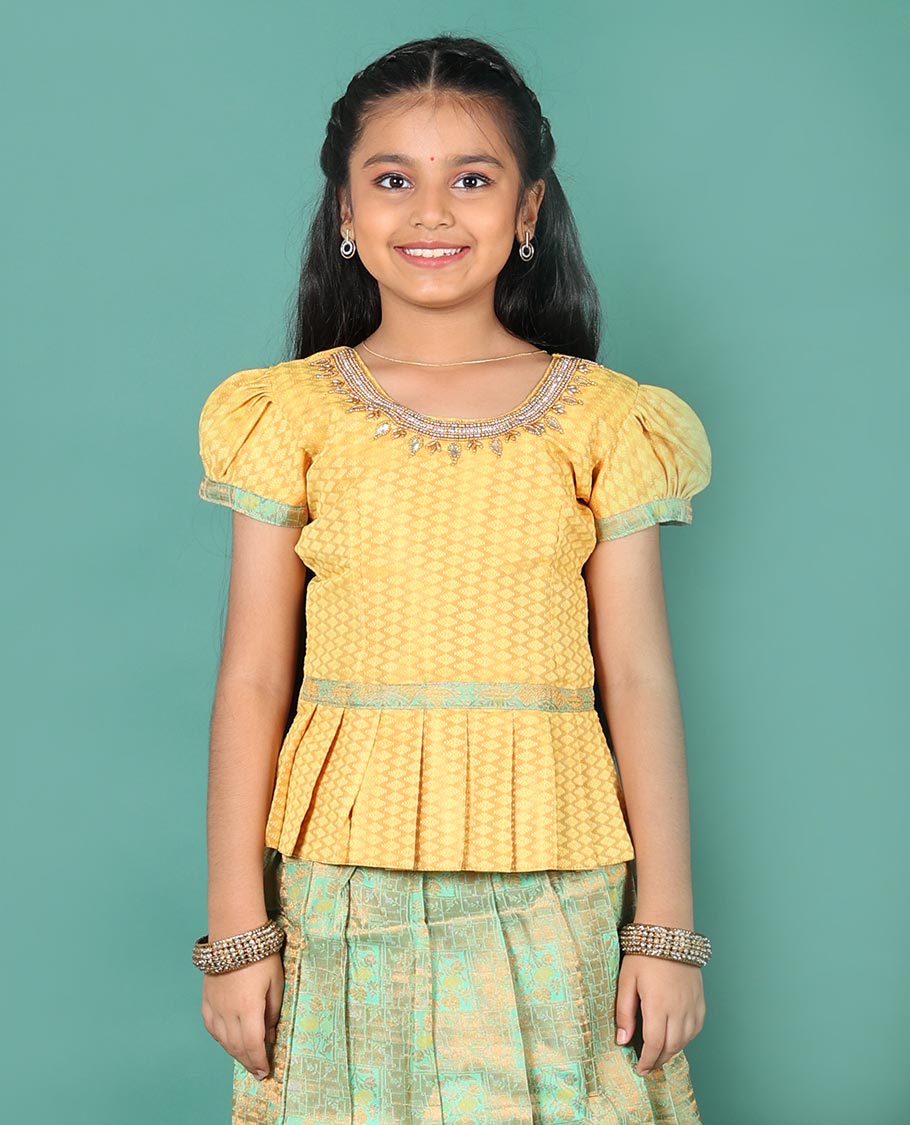 Green art silk readymade pavadai set, jacquard with contrast traditional zari border skirt, and contrast round neck embroidered puff-sleeve blouse