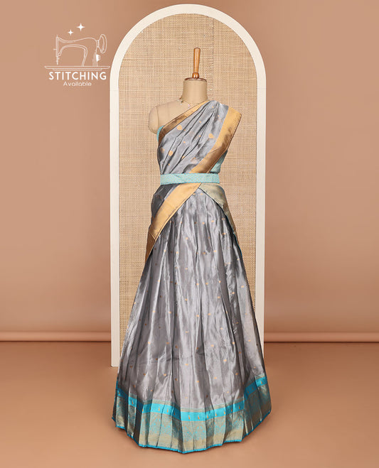 Grey floral jaal design half saree with contrast zari design border , checked zari design blouse & floral zari design dhavani