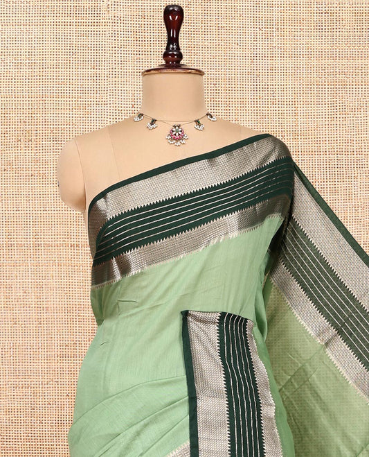 Pista Green Plain Assam Silk Saree, Complemented by a Contrast Traditional Zari Border, Zari-Striped Pallu, and a Contrast Blouse