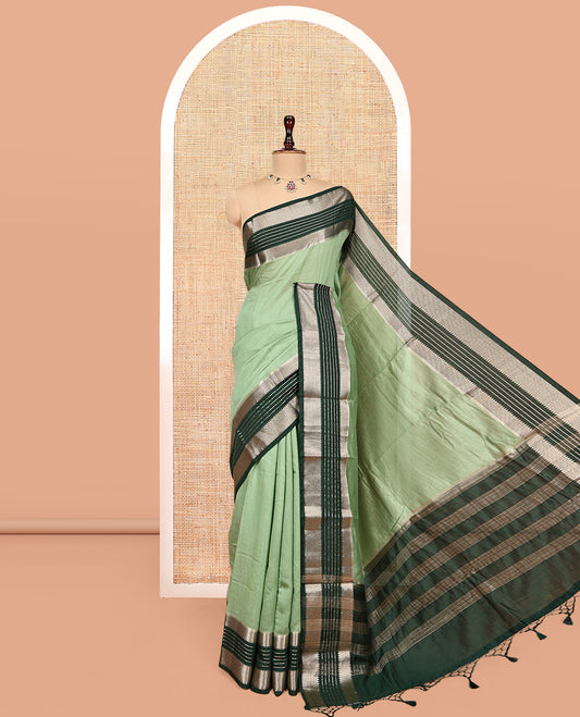 Pista Green Plain Assam Silk Saree, Complemented by a Contrast Traditional Zari Border, Zari-Striped Pallu, and a Contrast Blouse
