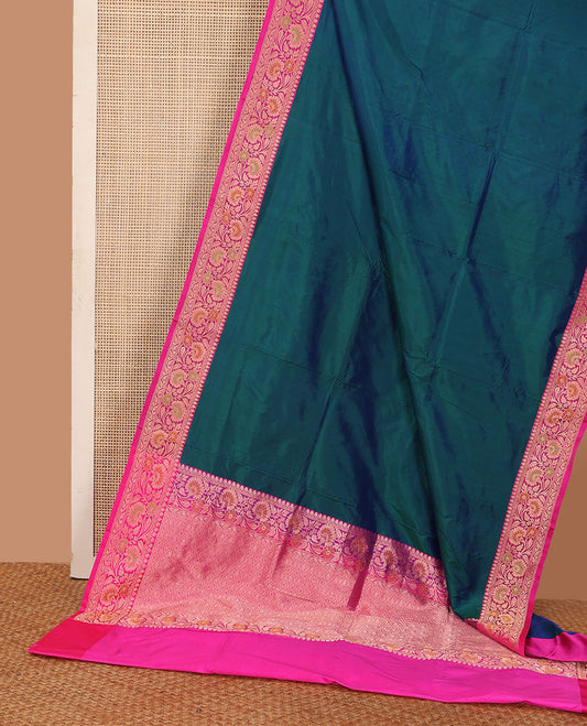 Peacock blue plain katan silk saree, contrast floral creeper border, and pallu of jaal deisgn