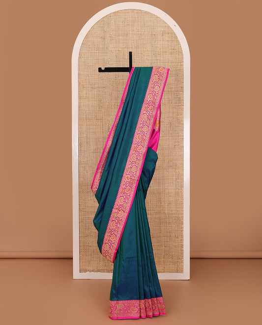 Peacock blue plain katan silk saree, contrast floral creeper border, and pallu of jaal deisgn