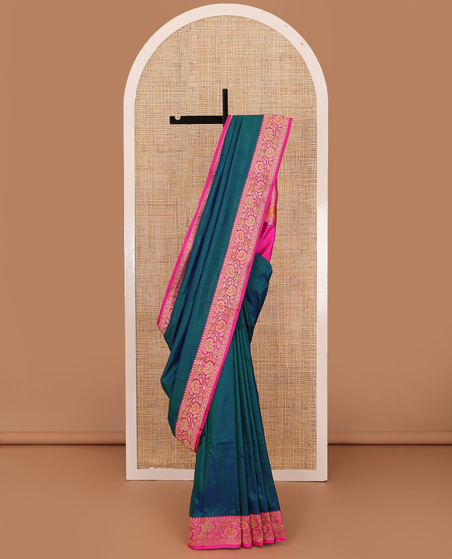 Peacock blue plain katan silk saree, contrast floral creeper border, and pallu of jaal deisgn