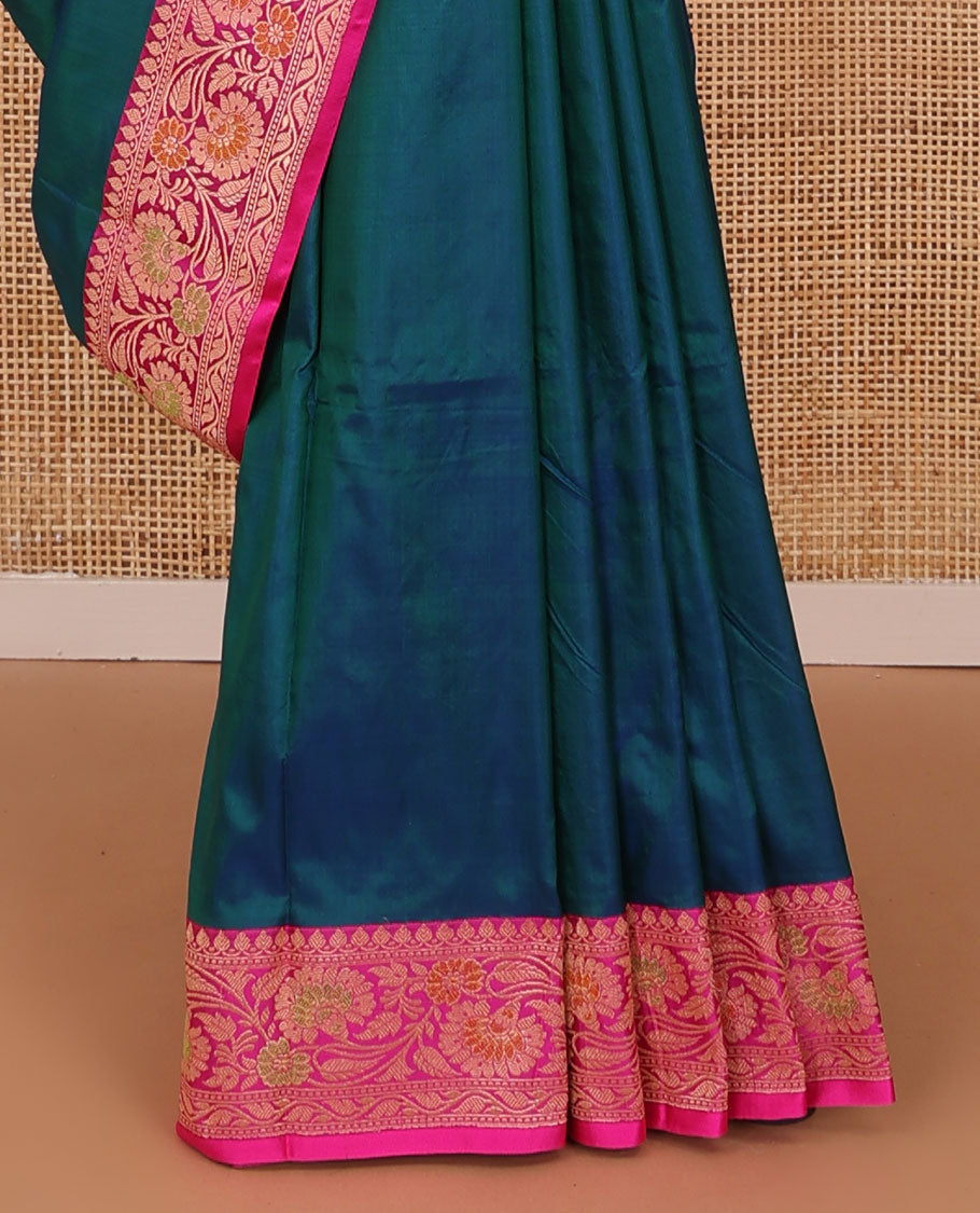 Peacock blue plain katan silk saree, contrast floral creeper border, and pallu of jaal deisgn