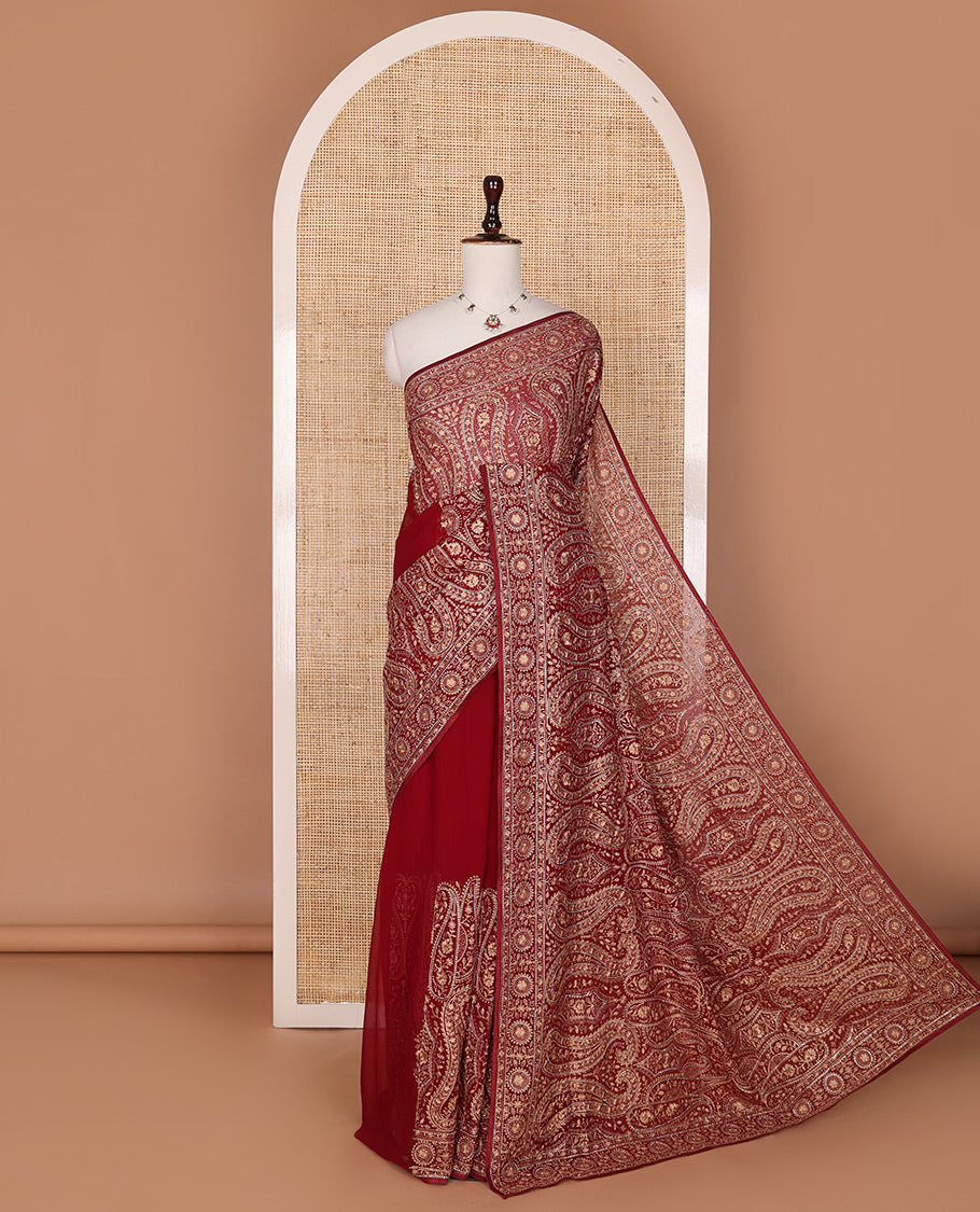 Light maroon base antique gold thread embroidered designer saree features Mughal style floral, and paisleys