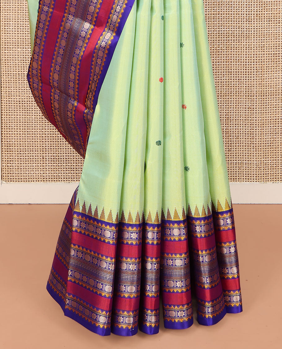 Green Kanchipuram Silk Saree, Beautifully Bedecked with Thread Buttas All Over Its Body, Complemented by a Contrast Border of Thazampoo Rekku, Muthu, Star Vanki, and Rudraksham Designs, Seppu Rekku Pallu, and Paired with a Contrast Blouse