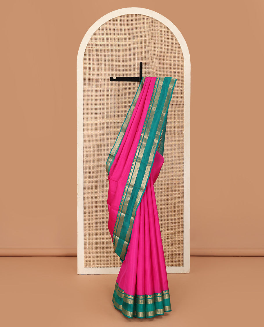 Pink plain Kanchipuram silk saree, contrast rettai pettu border of thazampoo rekku, neli, chakram, and kuthirai, and jaal pallu