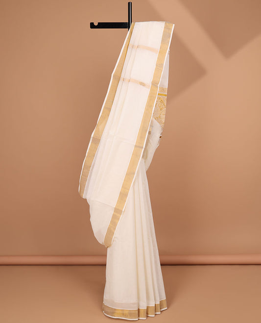 Cream kerala saree with zari stripes, zari border & pallu of peacock designs in zari