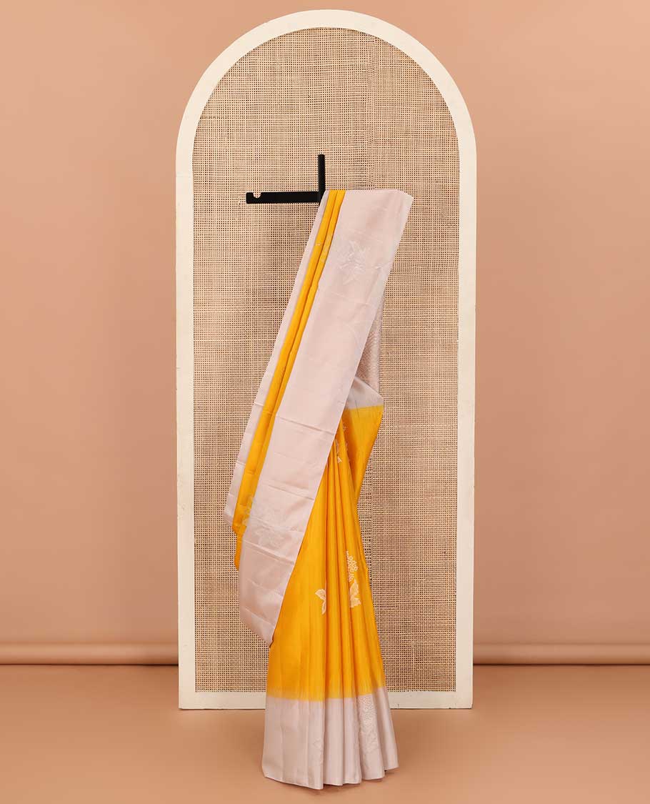 Yellow floral buttas soft silk saree, contrast border of floral buttas, and intricate pallu
