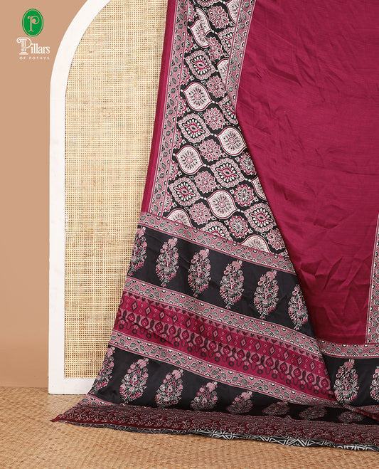 Wine color half-&-half style modal satin saree features floral & geometric design Ajrakh printed contrast border & pallu