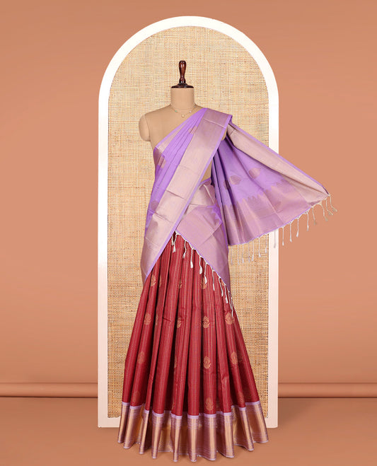 Maroon Art Silk Material Half Saree Set, Ornamented with Zari Buttas and Checks on Its Skirt, Complemented by Contrast Traditional Zari Design Border, Paired with a Contrast Blouse, and an Intricately Designed Dhavani