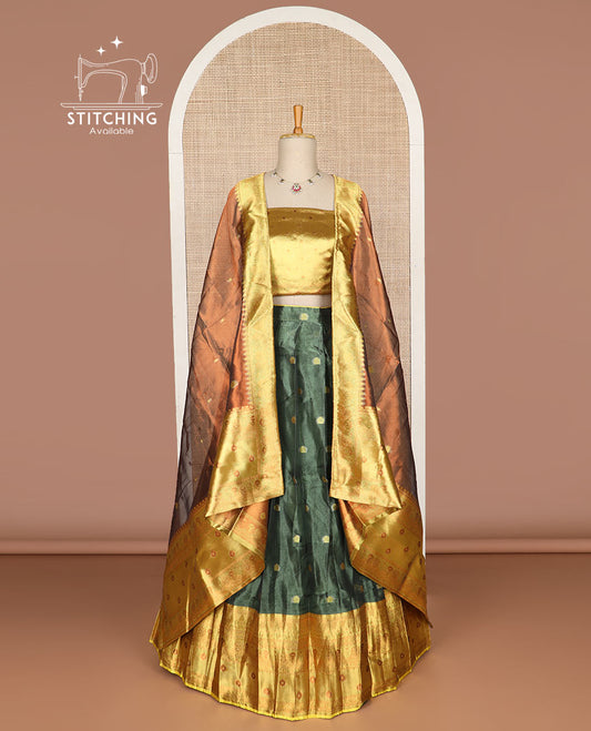 Dark green floral buttas tissue half saree with contrast zari design border, floral design blouse & floral design dhavani