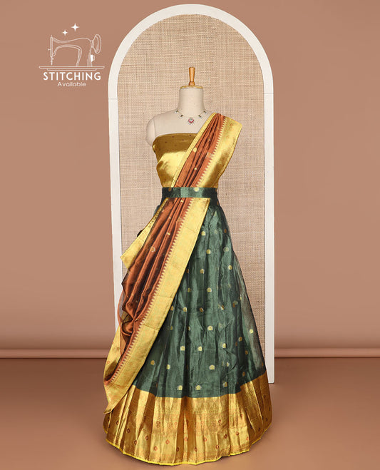 Dark green floral buttas tissue half saree with contrast zari design border, floral design blouse & floral design dhavani